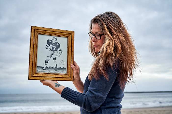 Linda Lee Stonebreaker holding a portrait of her father